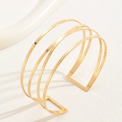 Handcrafted Gold-plated Geometric Cuff Bracelets And Boho-chic Metal Tassel Arm Rings With Vintage-inspired Exaggerated Water Drop Designs, Offering Unisex Luxury Accessories In Open Bangle Styles